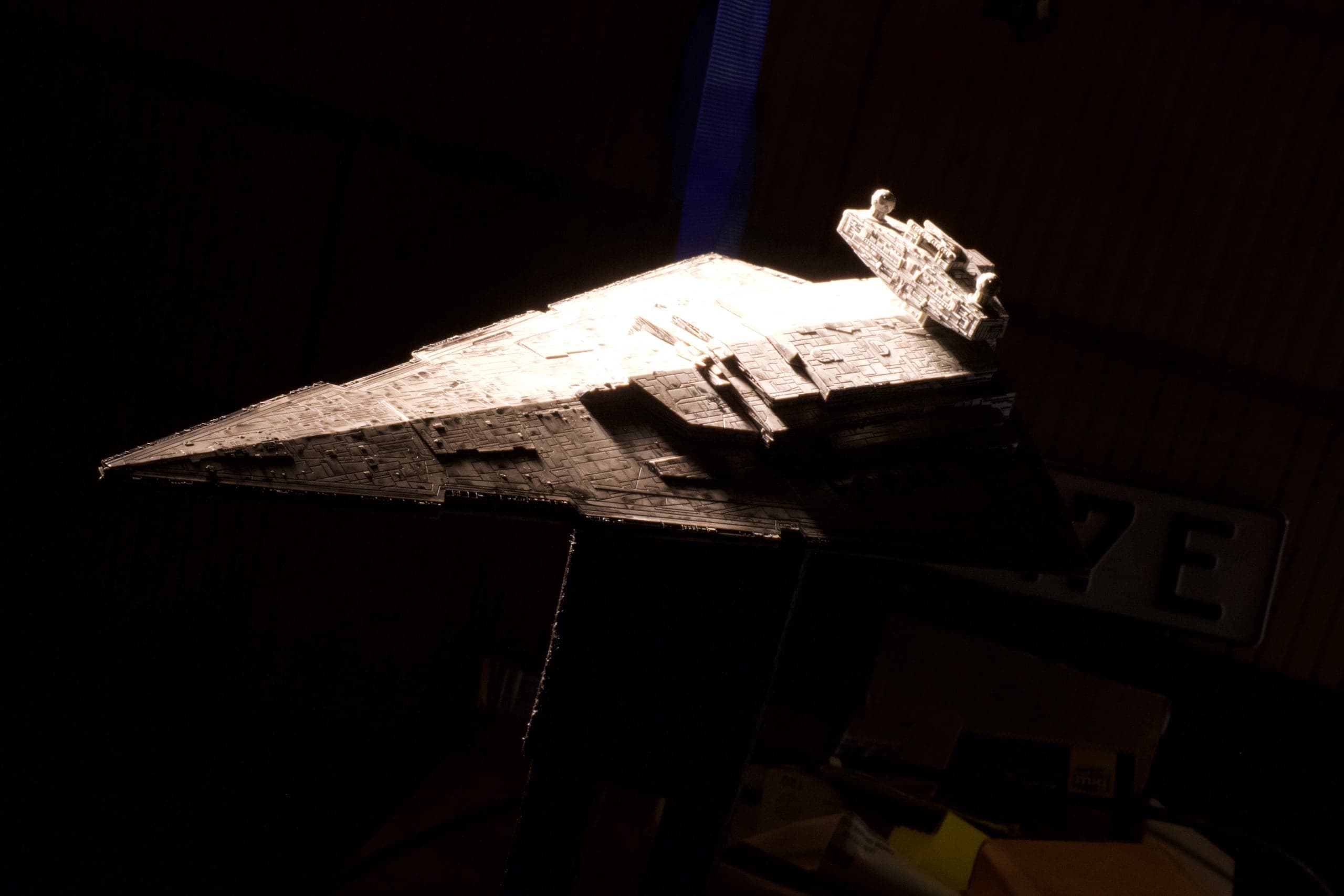 Stern of the starship miniature under raking light